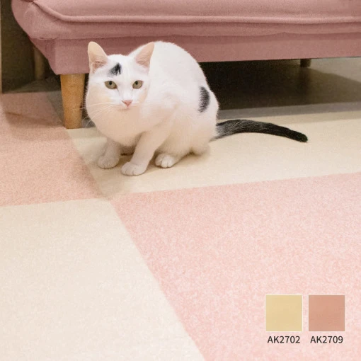 Cat sitting on pale pink and cream TOLI AK27 carpet tiles